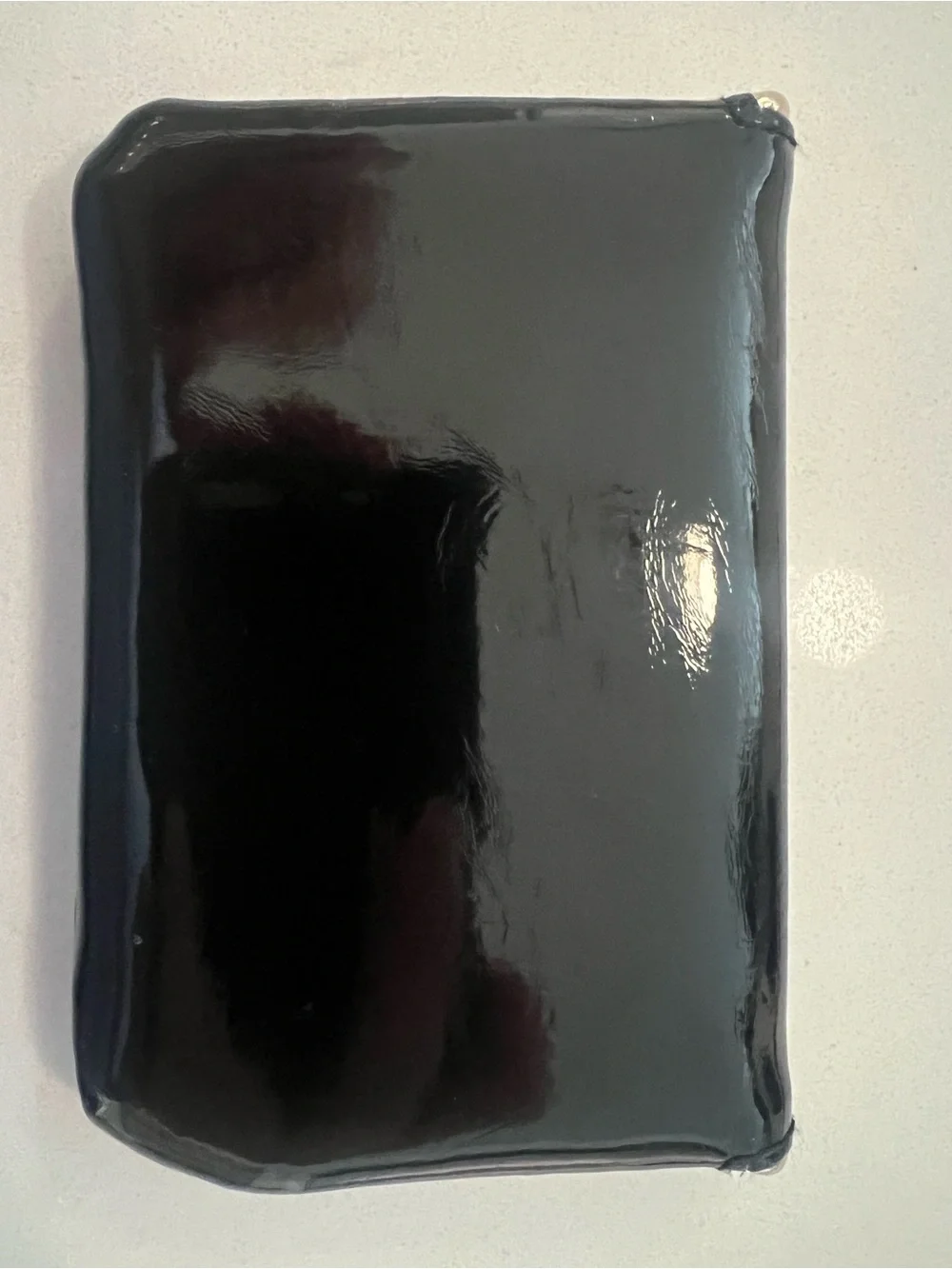 YSL beauty Black glossy pouch.